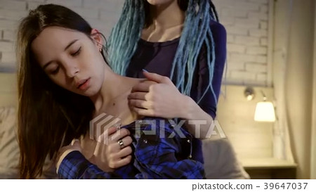 two young lesbian girls are embracing and - Stock Footage 