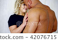 Muscular naked man pinned his wife up against... - Stock Footage