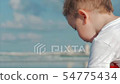 Cute Little Child Plays Near the Sea, Kid Catches - Stock Footage [54775434]