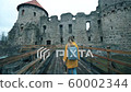 Girl walking near an ancient castle. - Stock Footage [60002344]