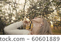 Attractive young woman in sweater, jeans is... - Stock Footage [60601889]
