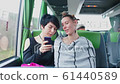 Two lesbians sitting in a tourist bus looking at - Stock Footage