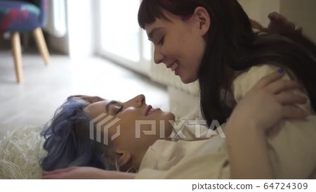 Young lesbian couple talking and kissing while... - Stock Footage