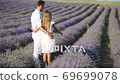 Family of two in lavender flowers field - Stock Footage [69699078]