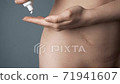 Footage of woman putting cream on the appendix... - Stock Footage
