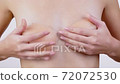 Young woman with small breasts trying on a... - Stock Footage