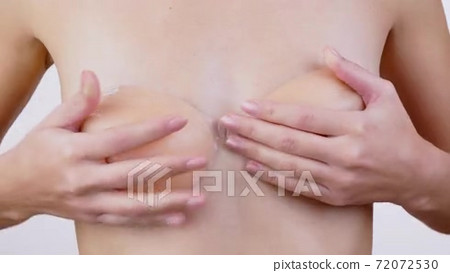 Young woman with small breasts trying on a... - Stock Footage 
