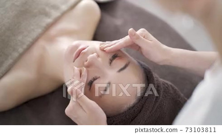 Japanese woman receiving facial massage at an... - Stock Footage