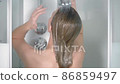 Young woman taking a shower. Beautiful girl... - Stock Footage [86859497]