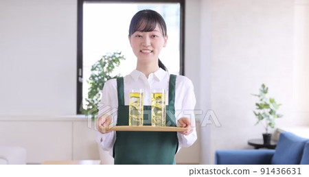 A young woman working part-time at a cafe - Stock Footage