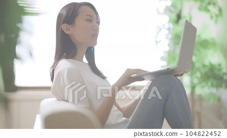 Young woman looking at a computer while... - Stock Footage