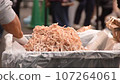 Tsukiji Outer Market: Sold squid by weight - Stock Footage