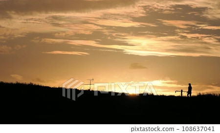 A woman walking her dog on the bank in the... - Stock Footage