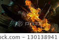 Close-up of blacksmith forging glowing hot iron on anvil with flying sparks. Super slow motion filmed on high-speed cinema camera at 1000 fps 130138941