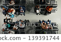 Talking, catching plane and top down view of people in busy airport terminal waiting. Chatting, boarding departure gate and high angle shot of diverse travelers with luggage and plane tickets 139391744