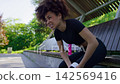 Woman Grimacing From Knee Pain After Workout Woman Grimacing From Knee Pain After Workout 142569416
